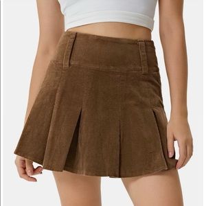 New HALARA skirt, Never worn original packaging and tags. Womens small brown.